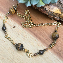 Load image into Gallery viewer, Gold Carved Tiger Eye Necklace 26”
